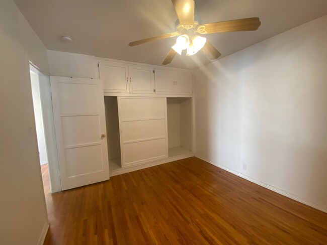 Bedroom 1 has lots of closet space and ceiling fan. - 5622 Kinston Ave