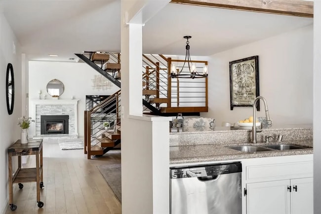 Building Photo - Spacious 1,550 Sq Ft Townhome | 2-Car Garage & High Ceilings w/ Exposed Beams