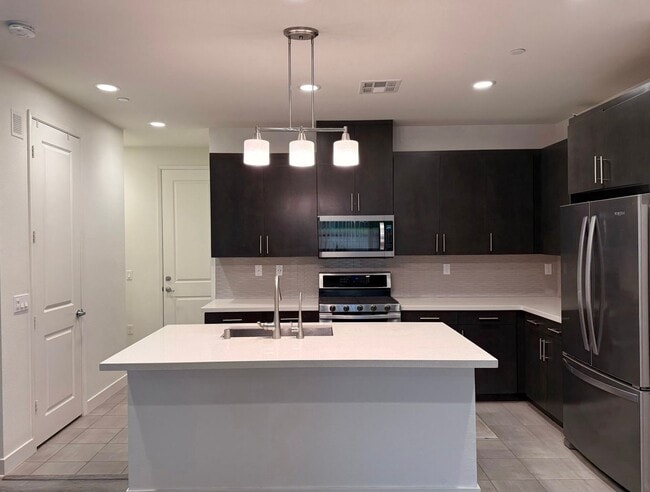 Building Photo - Stunning 3-Bed/2.5-Bath End Unit Condo with Solar & Large Yard