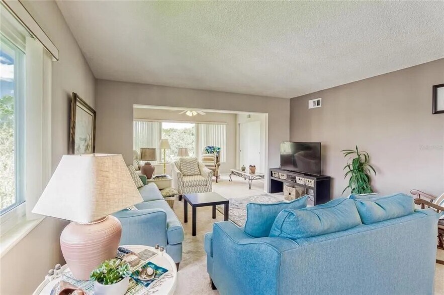 Living room looking towards Florida room [Unit is unfurnished] - 2460 Franciscan Dr