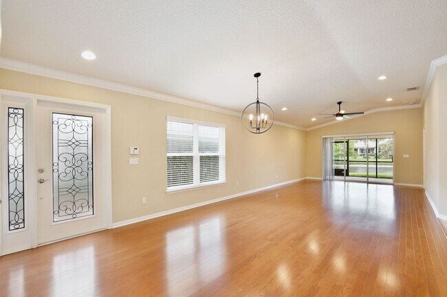 Building Photo - Gorgeous 2/2 + Den Mediterranean Villa with Waterfront Screened Patio and 2-Car Garage in the Pre...