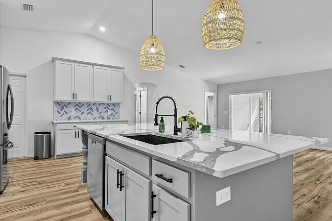 Building Photo - Modern 4-Bedroom, 3-Bath Home with Private In-Law Suite – Palm Coast, FL
