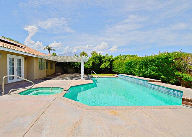 Building Photo - "Charming Oasis: 3-Bedroom Cathedral City Retreat with Pool, Fireplace, and Granite Kitchen!"