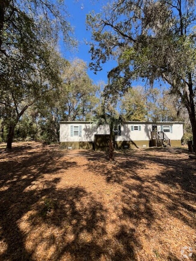 Building Photo - Charming 2-Bedroom Home on Spacious Wooded...