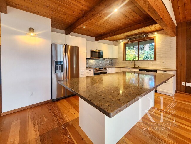 Building Photo - Waterfront Living in Indianola – Dock, Bea...