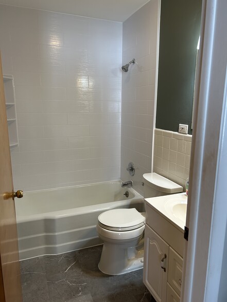 Full bath on first floor. New flooring and tub surround. - 4510 Allegheny Rd