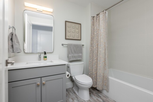 En-Suite Guest bathroom with deep soaking tub/shower. - 383 Commercial St