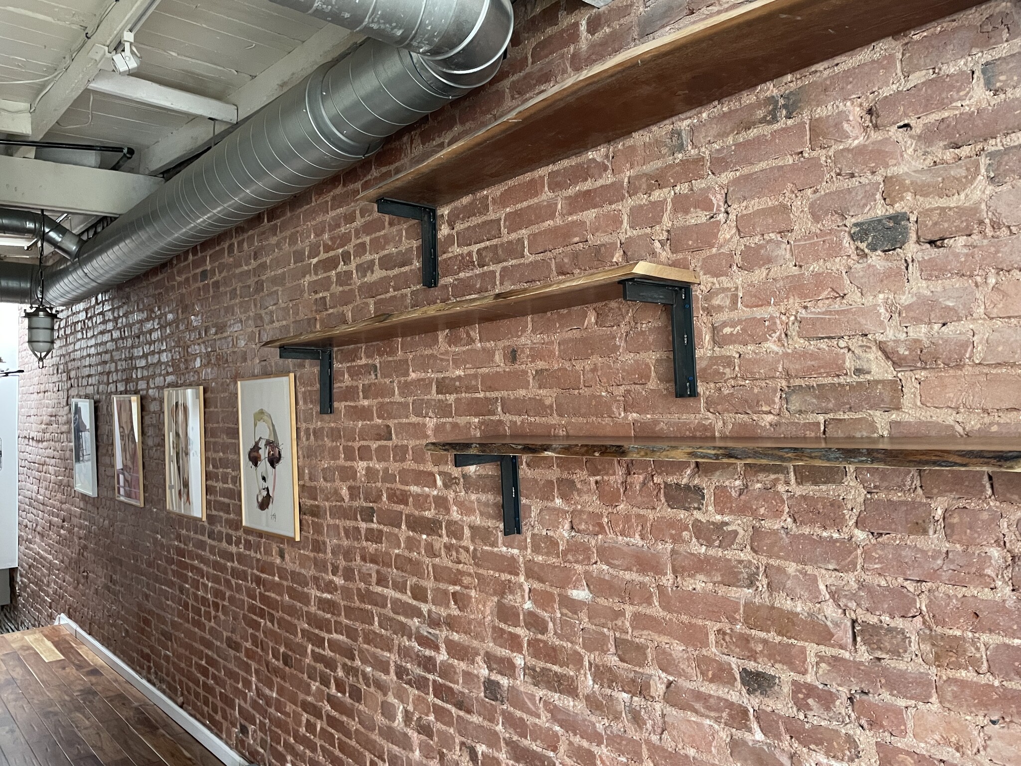 Expose brick wall with inset book shelves - 1003 P St NW