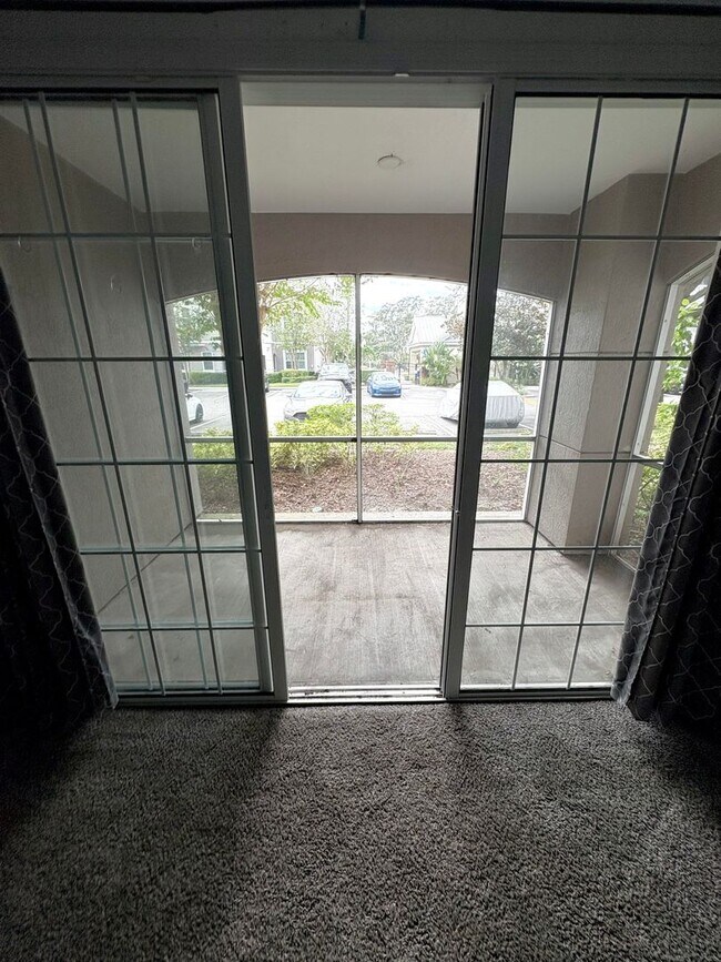 Building Photo - AVAILABLE NOW: First-floor 2-bedroom, 1-bath condo in Gated Community