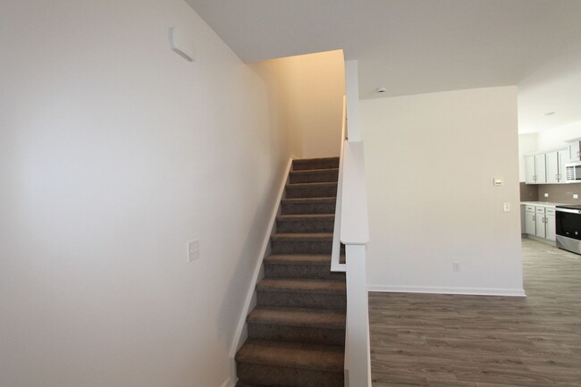 Building Photo - NEW 3 Bedroom Townhome Minutes from Downto...