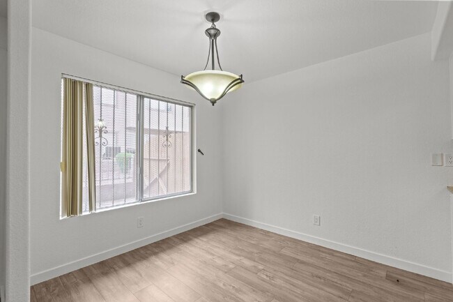 Building Photo - "Charming 3-Bedroom Townhouse Oasis with 2 Full Baths in Las Vegas – 1220 Sq Ft of Comfortable Li...