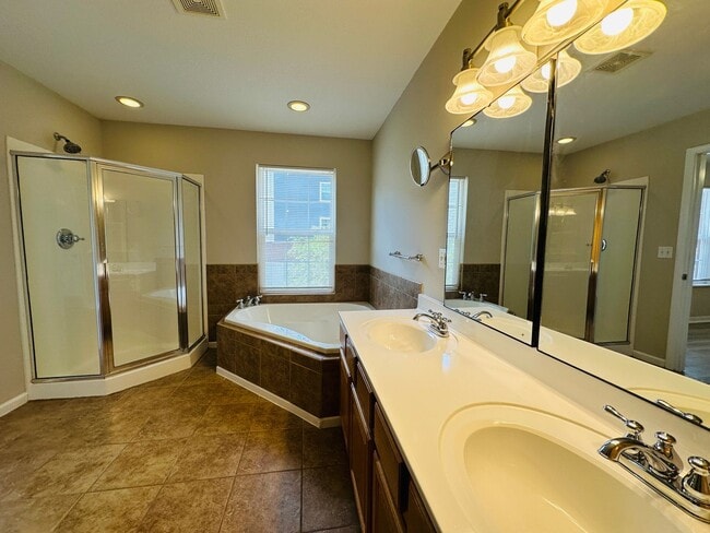 Building Photo - 2 bed, 2.5 bath updated townhouse w/ 1-car garage & Trex deck available now