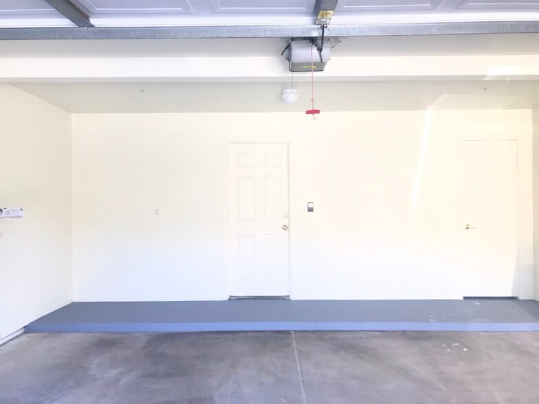 Double car garage with freshly painted platform - 3030 N Hayden Rd
