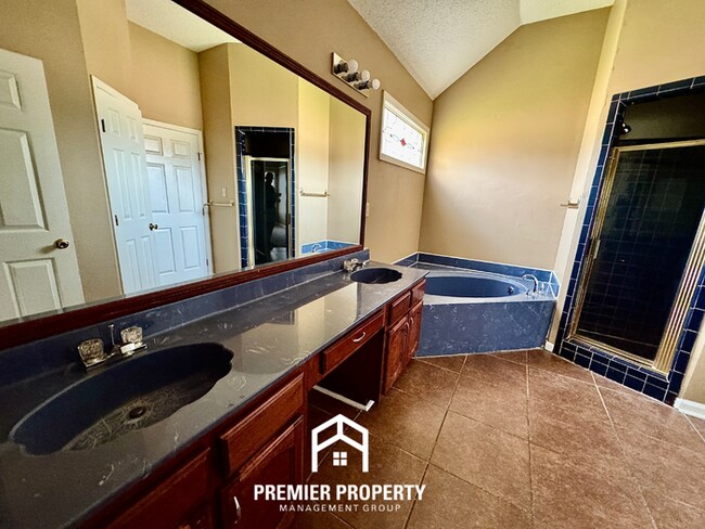 Building Photo - Spacious 3BR/2BA Near Southwind | 1,958 Sq Ft, Brick Fireplace, 2-Car Garage & Quiet Cove