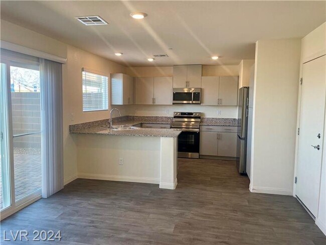 Building Photo - Brand New 4 Bedroom Townhome-Sunrise Manor