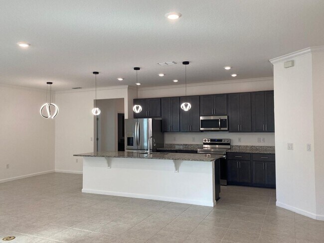 Building Photo - Like New 3 bedroom + den with French doors, screened in porch and Fenced yard and much more...