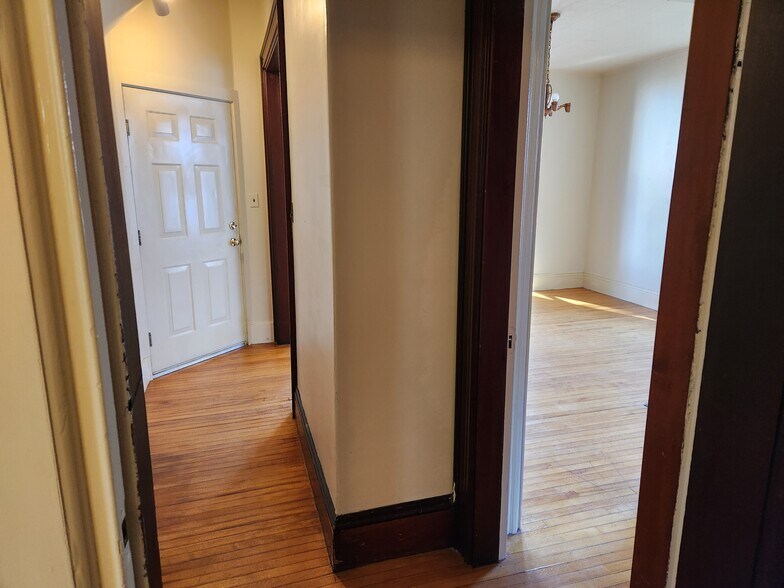 Looking back at front door and bedroom 1 from middle room - 46 Saunders St