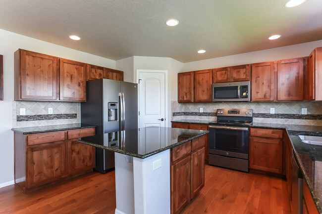 Kitchen with Island and Pantry - 3453 Curlew Dr