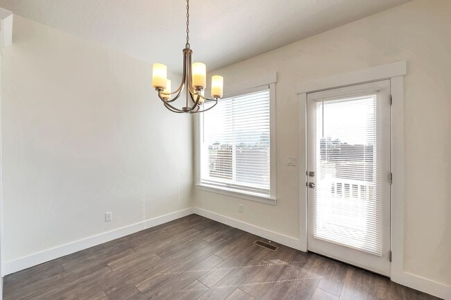 Building Photo - Modern Row End Townhome w 2 car attached g...