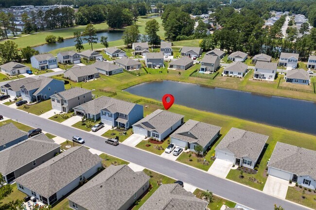 Building Photo - Modern 4BR Home with Screened Porch & Pond Views | Sun Colony, Longs SC