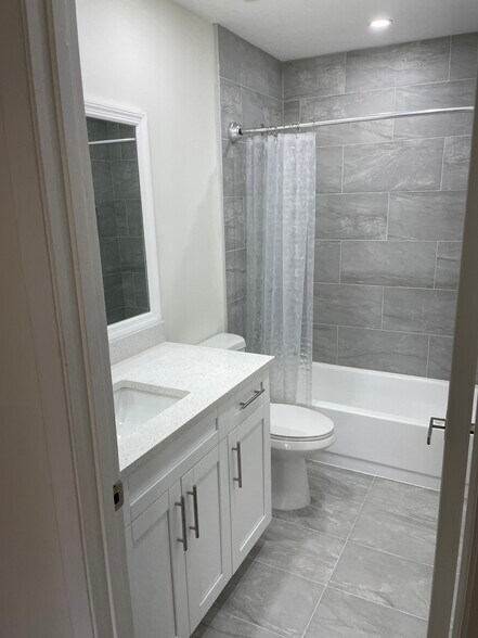 Upgraded, clean bathrooms w granite counters. - 3939 NE 5th Ave