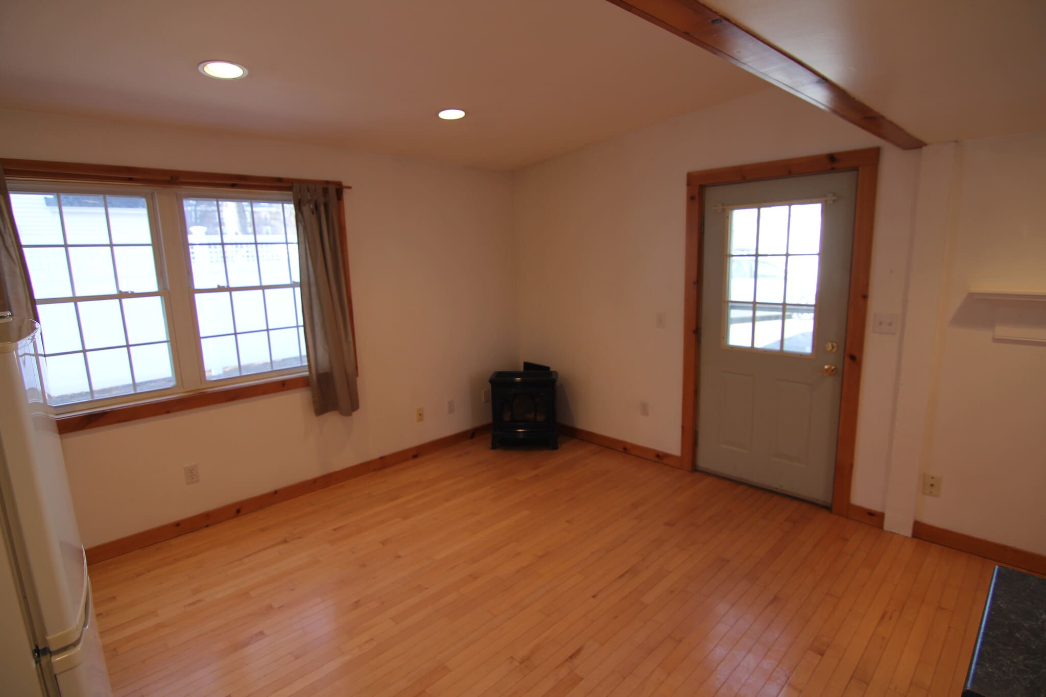 Standing in kitchen looking at gas fireplace. - 37 Court St