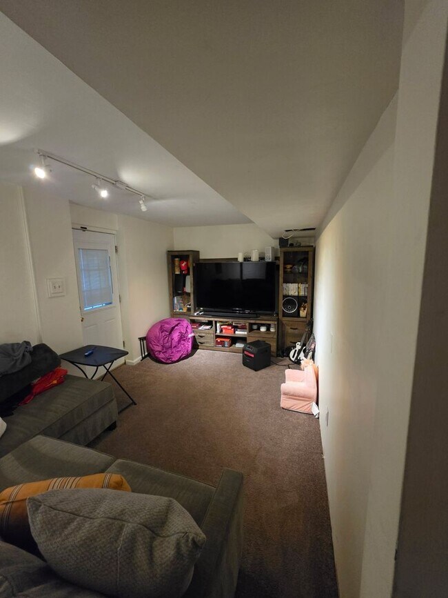 Building Photo - Stunning 3–4 Bedroom Townhome in Private Community | Garage + EV Charger | Deck with Tree Views