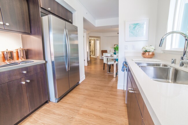 Coveted stainless steel-french door refrigerators and under cabinet lighting - The Arroyo Residences