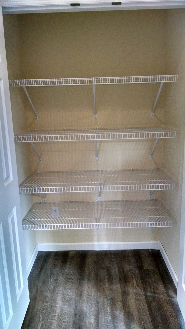 2 double door storage closets with shelving and clothes rod - 1 E. Main St.