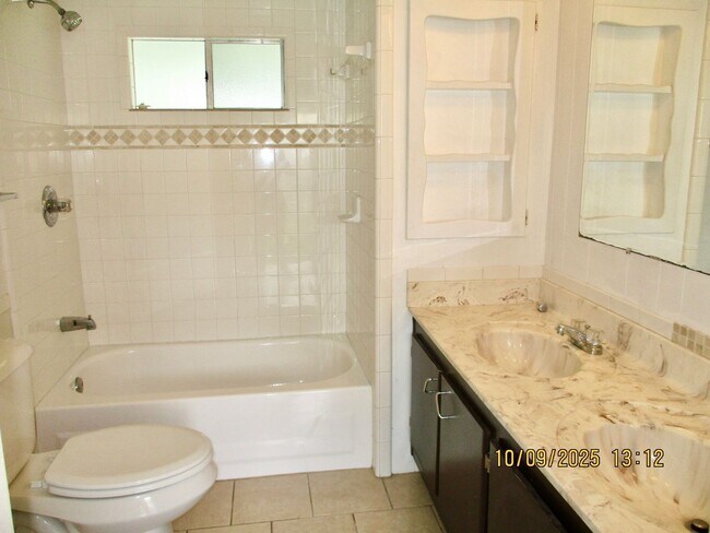 Building Photo - Welcome to this inviting 2-bedroom, 1-bath...