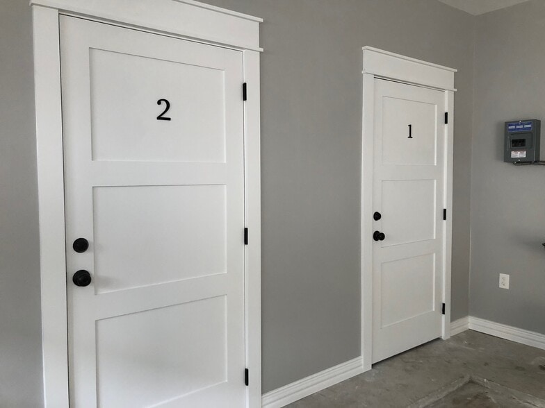 outside storage closets with locks located inside the garage - 1928 Harold St
