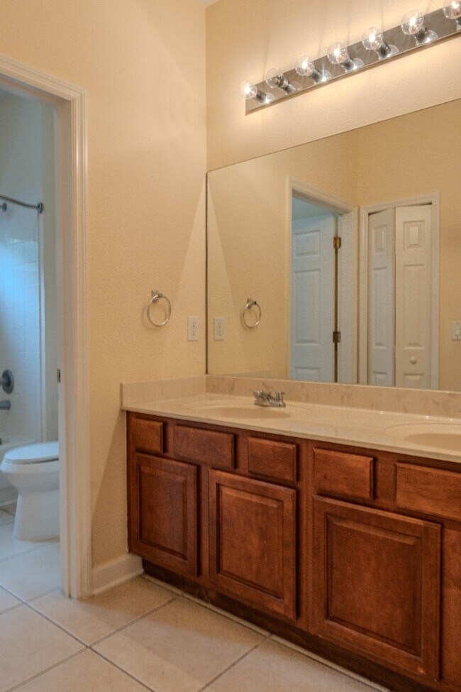 Building Photo - Spacious 5BR Home in Falcon Trace | 3-Car Garage | Screened Patio | Resort-Style Amenities Rent: ...