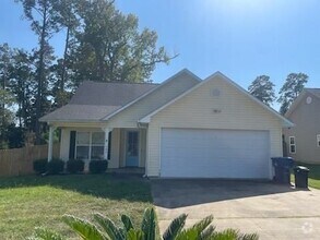 Building Photo - This spacious 3-bedroom, 2-bathroom home j...