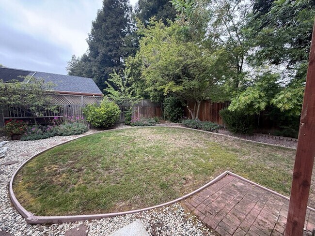 Building Photo - Private Redwood Setting | 4BR Home with Family Room, Bar & Garage Workspace - Available Now