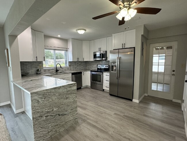 Building Photo - "Elegant 3-Bed Waterfront pool Home"