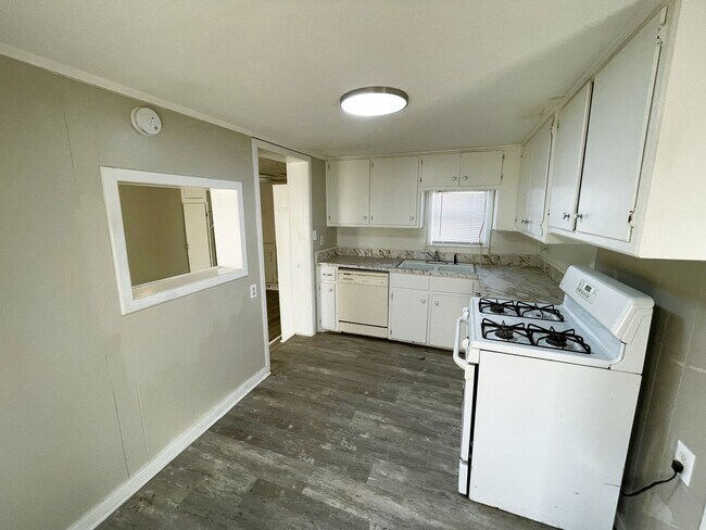 Building Photo - Spacious Home Featuring Two Living Areas I...