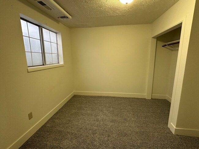 Building Photo - Spacious, three level, 4 Bed 2.5 bath Townhome in Ammon right behind the Walmart on Hitt.