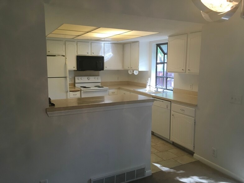 Kitchen with unique window above the sink. Great for plants - 12063 Burdette Cir
