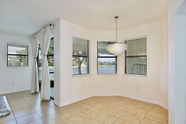 Building Photo - Water-View 4BR/3BA with 3-Car Garage in Gated North Shore - Near Lake Nona & Medical City