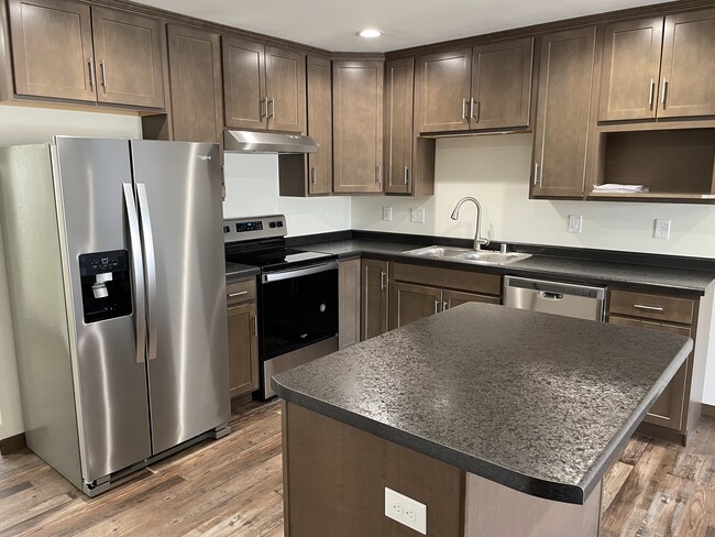 stainless steel appliances and kitchen island - 535 Ryan St