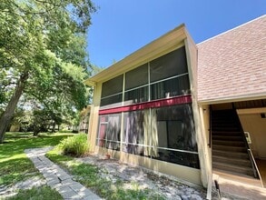 Building Photo - Beautiful Corner Unit with Vinyl Plank Flooring & Private Screened Patio