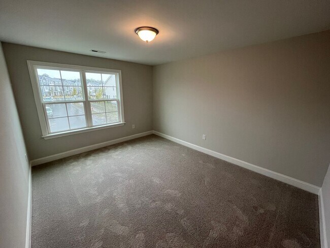 Building Photo - Newly Built 4BD, 3BA Cary Townhome with Modern Amenities and Screened-In Patio