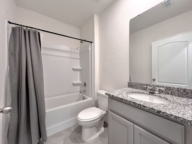 Building Photo - Four-Bedroom Home with Modern Finishes & Open Layout