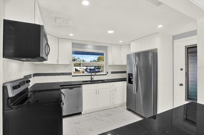 Building Photo - 7902 Canna Dr