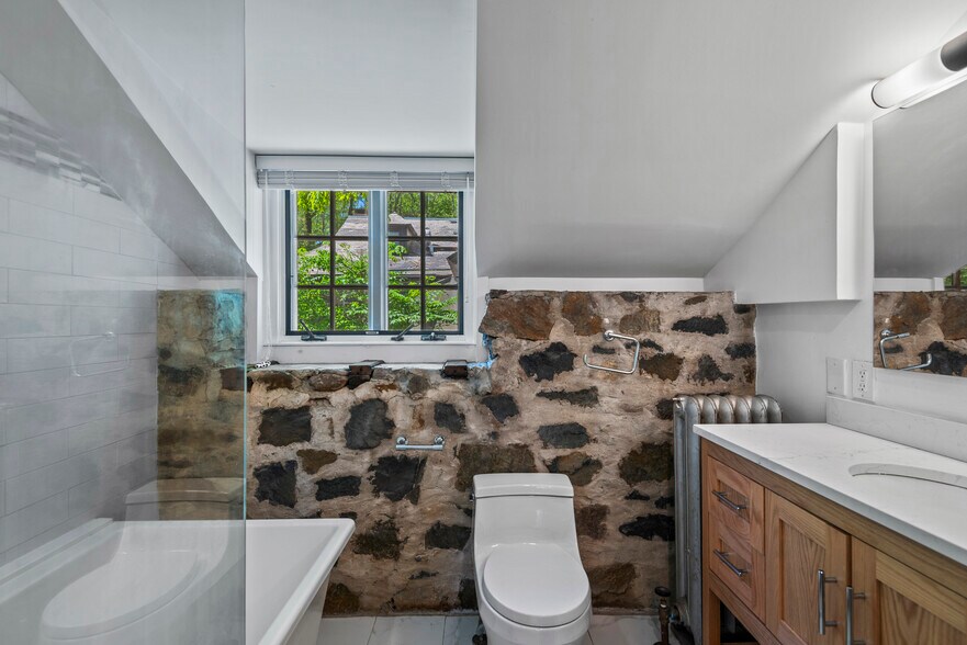 bathroom with exposed stone walls - 128 Blake Rd