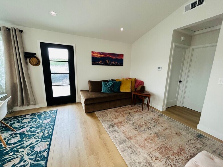 Entrance and livingroom space with West Elm furniture - 4415 Catalpa St