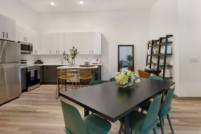 Modern home amenities include stunning kitchens outfitted with Energy Star® stainless steel appliances, quartz countertops, elevated 9-foot ceilings, and a keyless entry system. - Modera Berkeley Heights