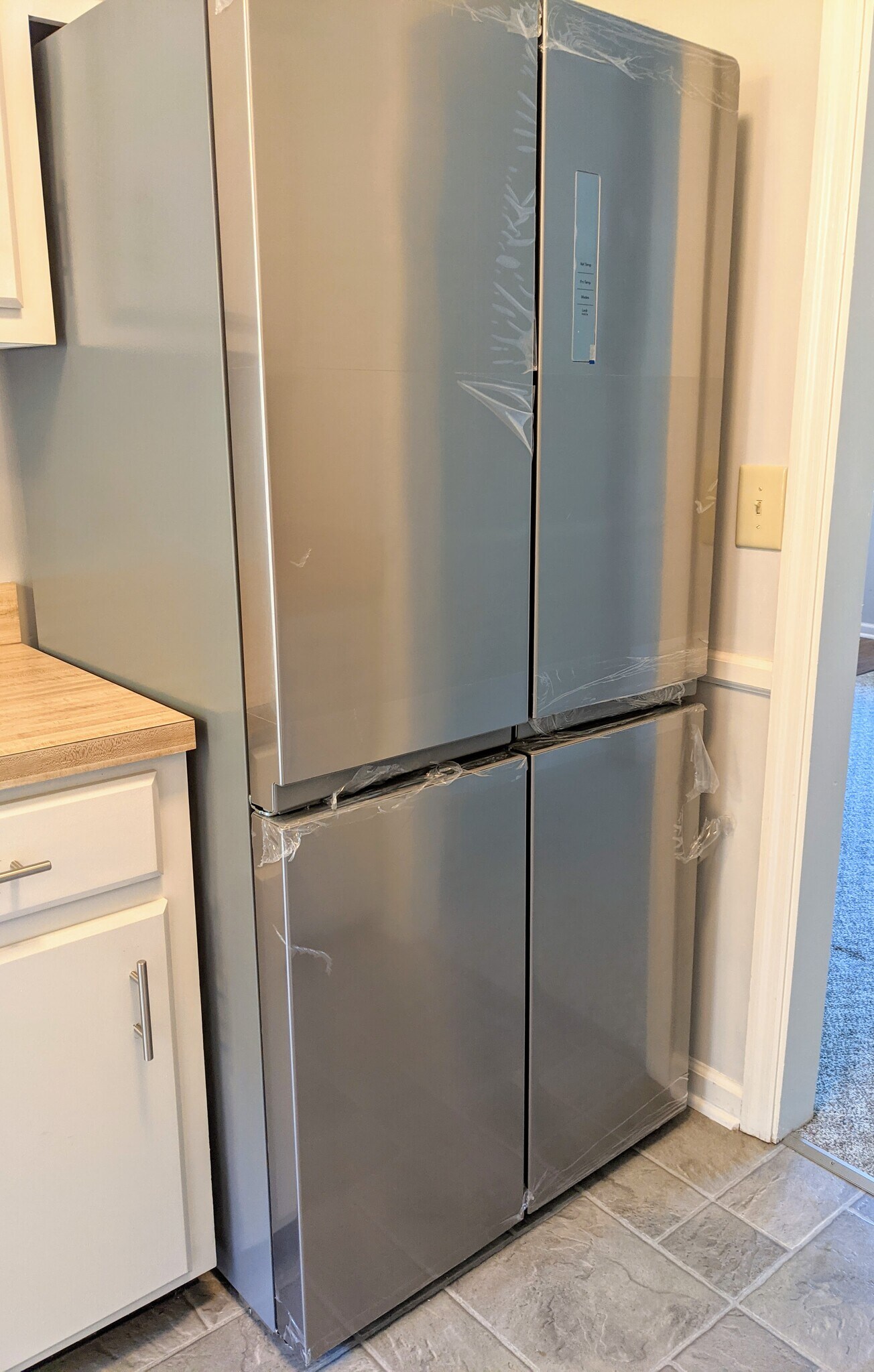 New stainless steel french door refrigerator. (Protective plastic still on surface in photo) - 3221 Hunters Point Dr