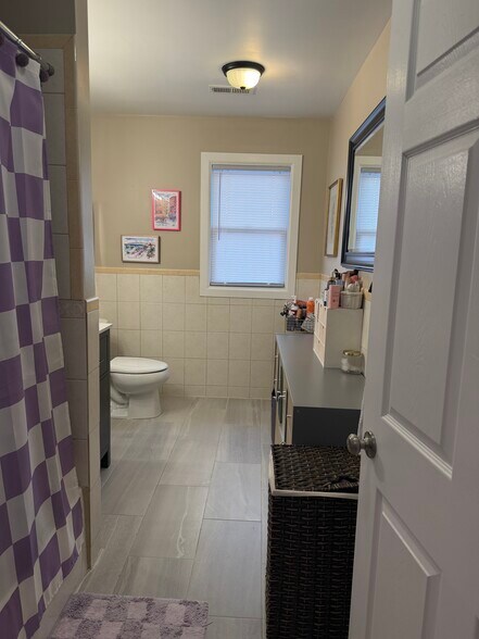 tiled bathroom with tub - 167 Newark Pompton Tpke