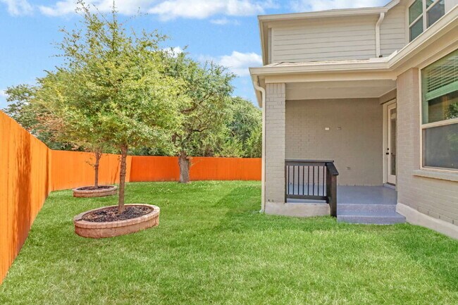 Building Photo - ASK ABOUT FREE APPLICATIONS THROUGH AUGUST!  "Spacious 4-Bedroom Sanctuary with Cozy Fireplace in...